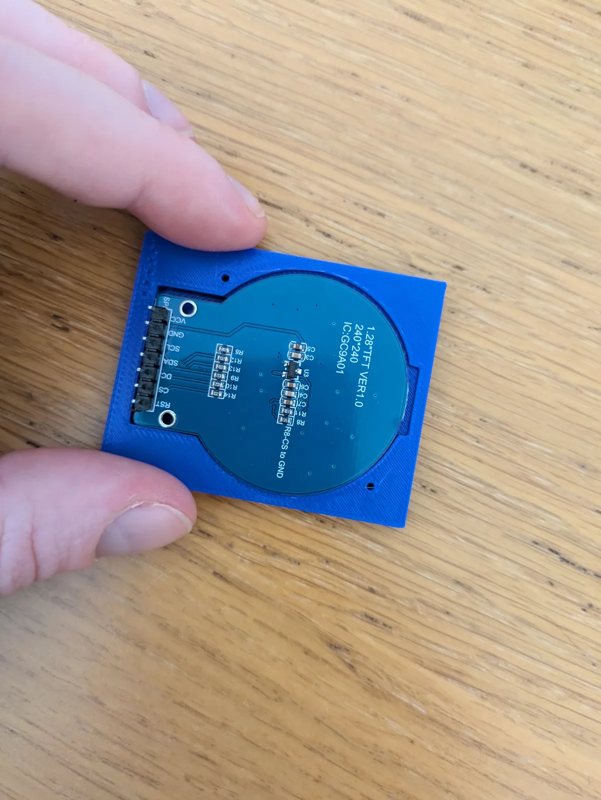 The GC9A01 display seated in the lid.