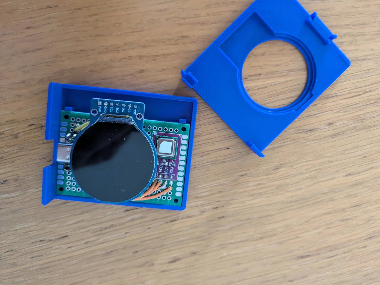 Blue base, sensor board and clip-on lid.