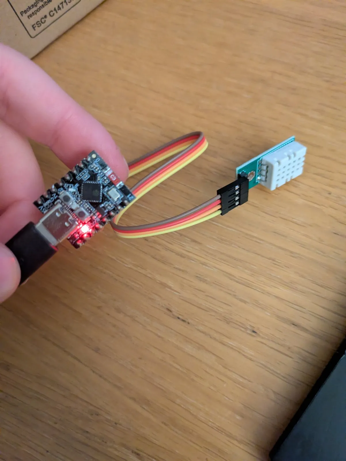 Early ESP32-C3 wired to a temperature and humidity sensor