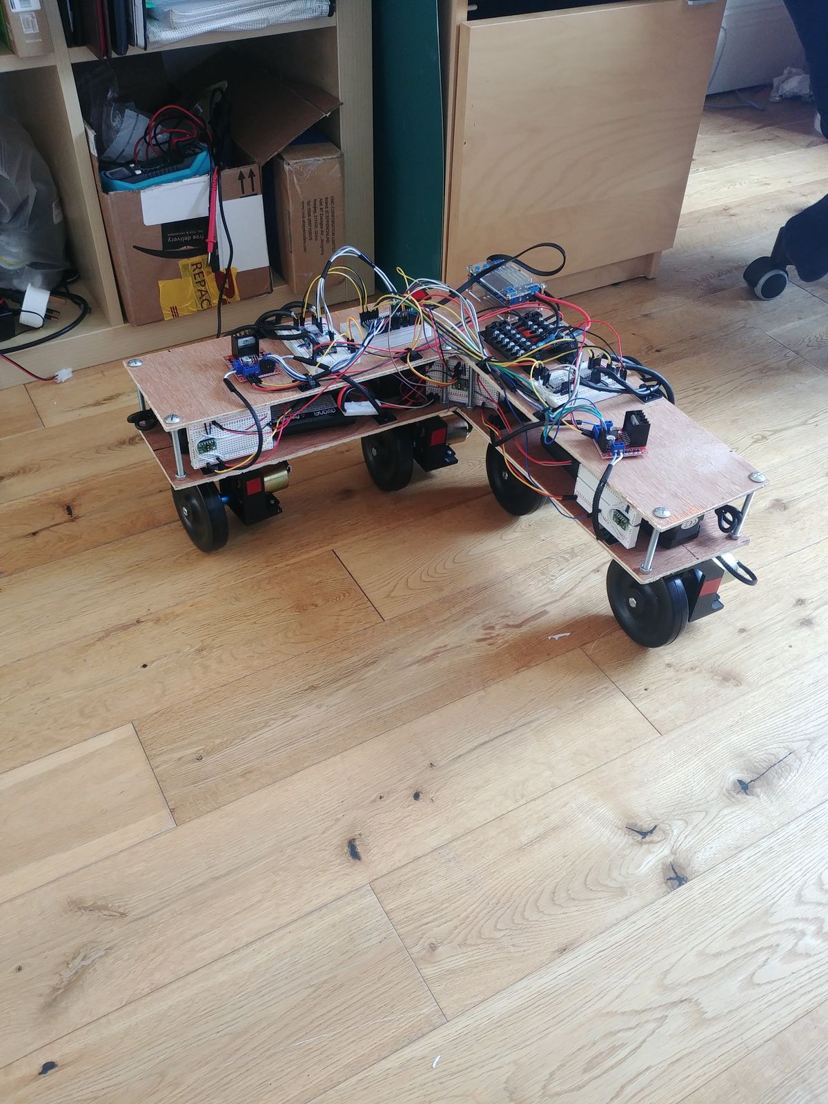 The first robot prototype complete, with its open frame and exposed electronics